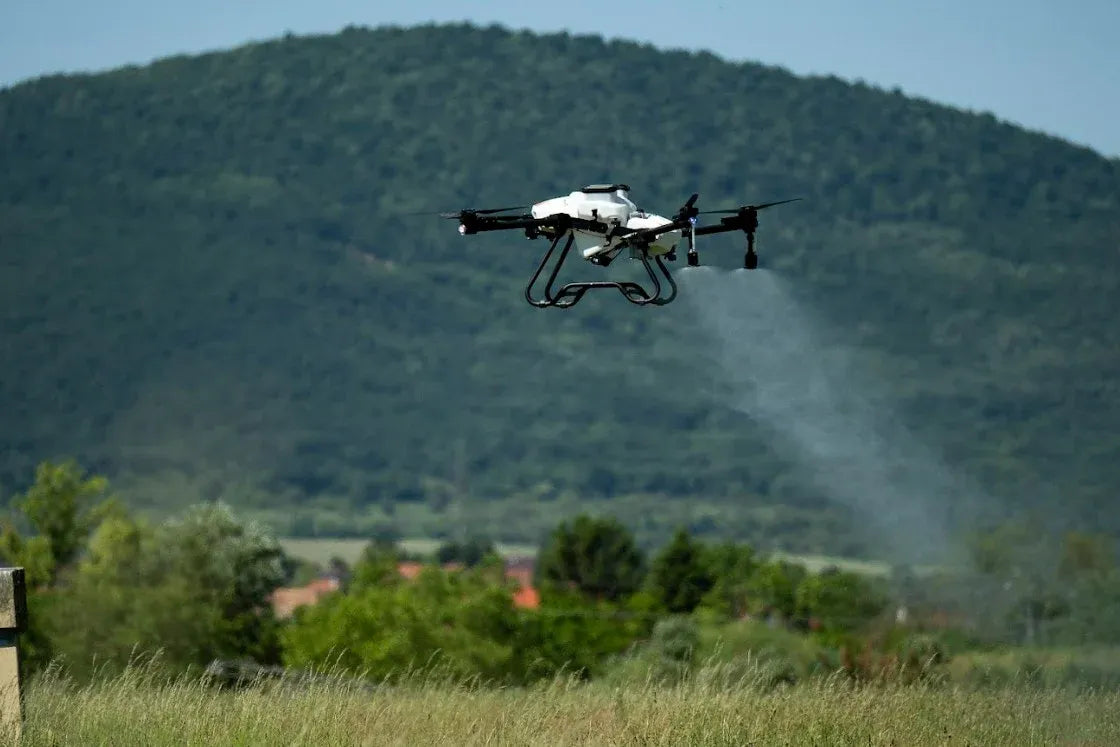 ABZ Innovation L30 drone spraying crops in field